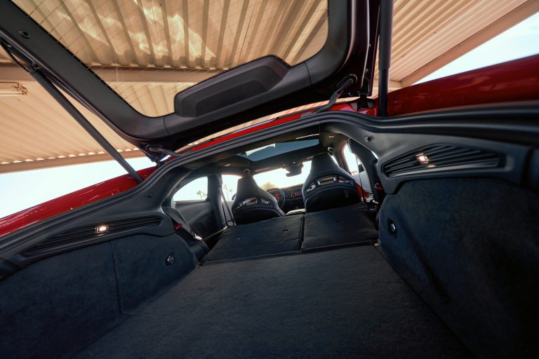 The 2026 Dodge Charger Daytona opens up inside to offer the utility of best-in-class cargo and rear cargo capacity in its powered “hidden hatch” muscle car design, with rear seats that fold flat.